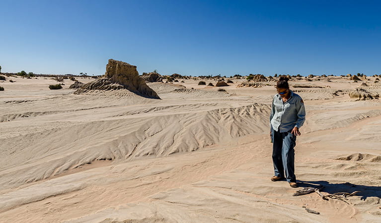 Ranger in front of the Walls of China, Mungo National Park. Photo: John Spencer