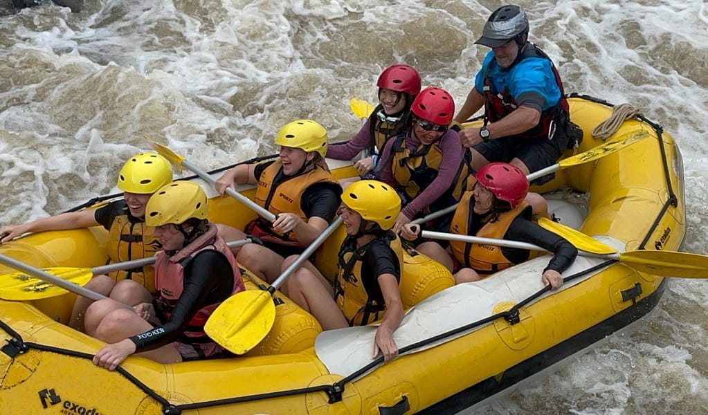 A group of kids whitewater rafting with an Exodus Adventures guide. Photo: Dingo Camps &copy; Exodus Adventures