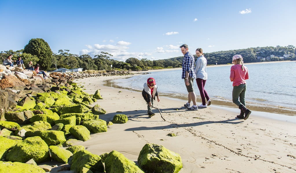 A family exploring the shoreline near Bonnie Vale campground in Royal National Park. Credit: Simone Cottrell/DCCEEW