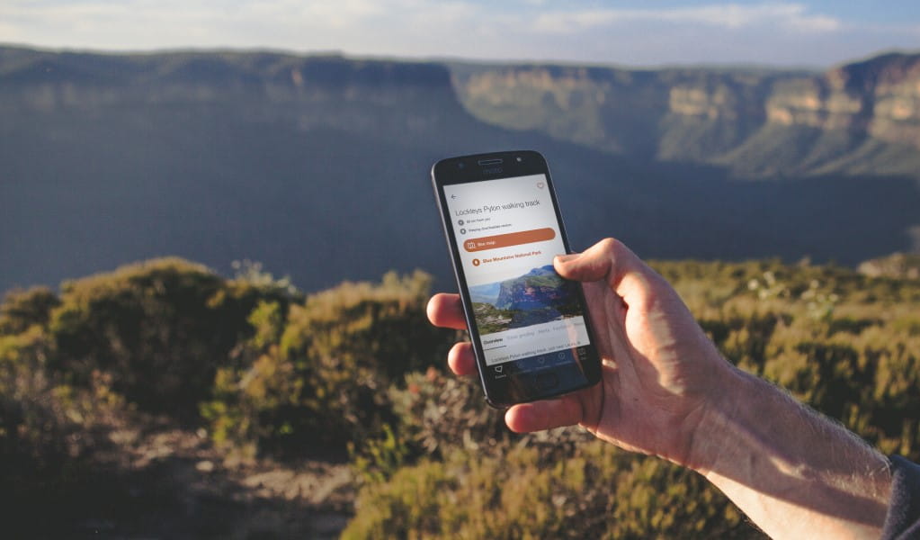 Visitor using app in Blue Mountains National Park. Photo: Daniel Parsons/Caravel Content 