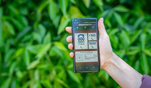 Person holding phone with the Emergency Plus app on screen. Photo: John Spencer/DPIE