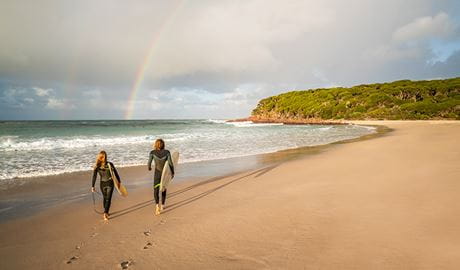 Surfers on the beach at Saltwater Creek campground, Beowa National Park. Photo: John Spencer/OEH