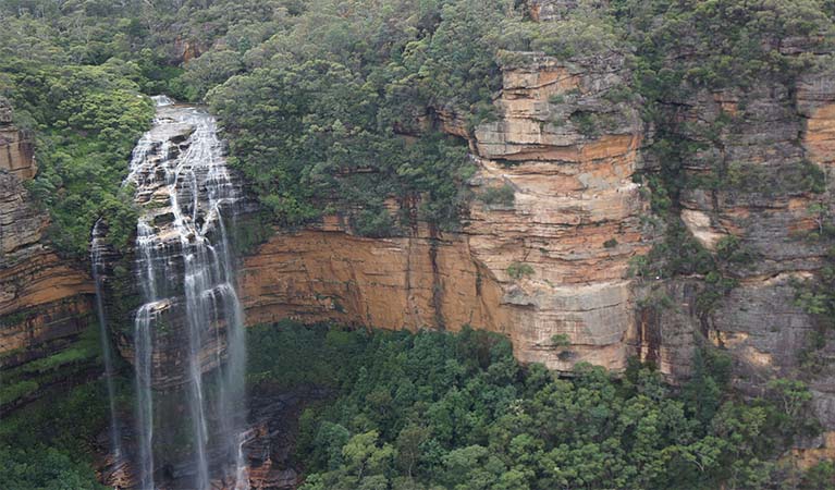 Wentworth Falls waterfall cascading down over the cliffside. Photo: Stephen Alton &copy; DPE