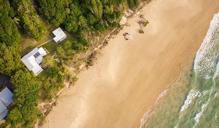 Ariel view of Partridge cottage and Geoffs shed located on Byron Bay beach. Photo: DPIE/John Spencer