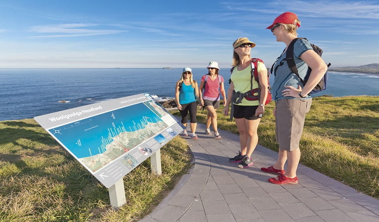 Visitors reading the map at Woolgoolga. Photo: Rob Cleary
