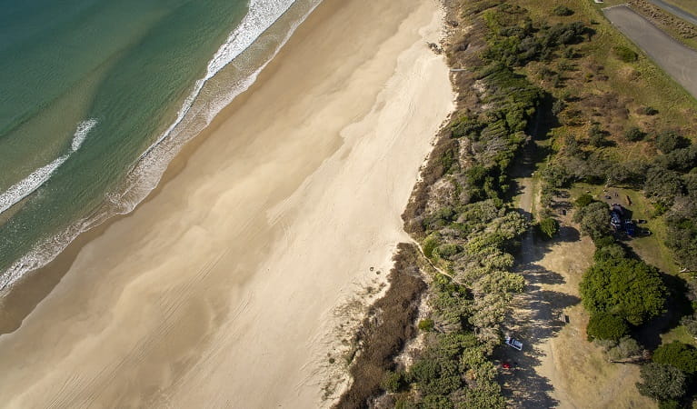 Aerial photo of Racecourse campground, nearby Goolawah Beach, beach access and carpark. Photo: John Spencer/OEH