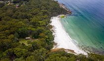 Aerial view of Greenfield Beach picnic area, Greenfield Beach and surrounding bushland. Photo credit: John Spencer &copy; DPIE