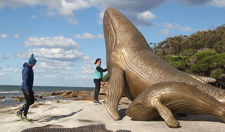 Huge bronze engraved whale sculpture on the rocks by the sea at Kurnell in Kamay Botany Bay National Park. Photo credit: Natasha Webb &copy; Natasha Webb