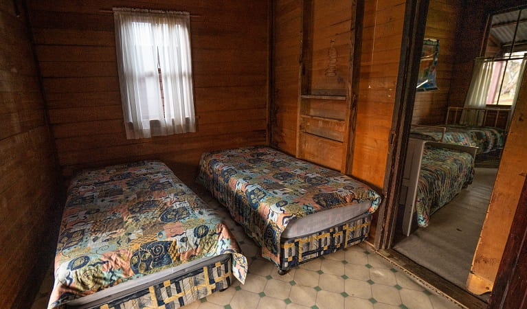 Two single beds at The Pines Cottage, Kosciuskzo National Park. Photo: Rob Mulally/DPIE
