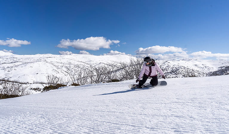 A snowboarder rides down a freshly-groomed run at Perisher, in Kosciuszko National Park. Photo: Images supplied courtesy of Perisher Ski Resort