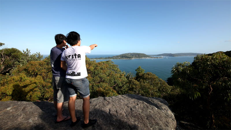 Two people enjoying West Head lookout at Ku-ring-gai Chase National Park. Photo: Andy Richards