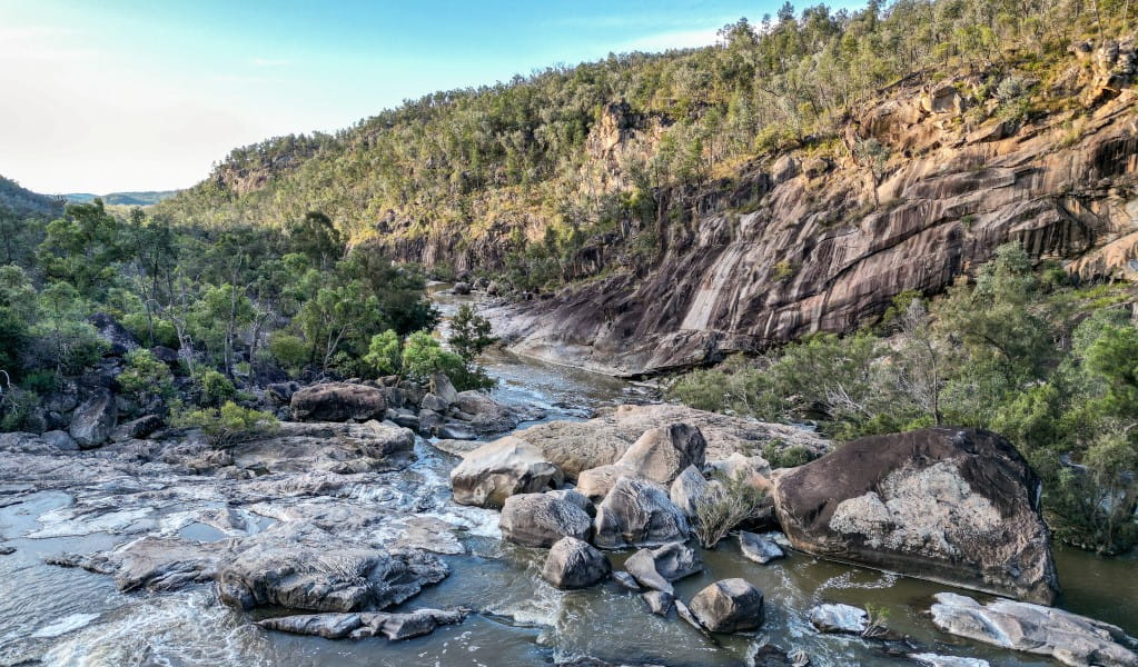 Water flowing through the gorge surrounded by rocky cliffs at Slippery Rock walking track in Kwiambal National Park. Photo &copy; DPE