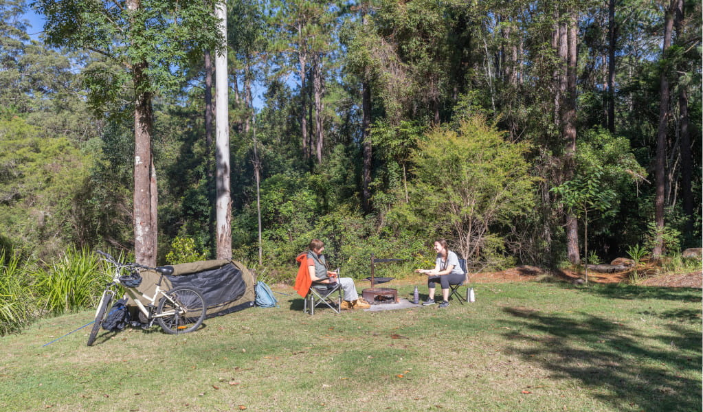 2 campers outside their tent, Cutters Camp campground. Credit: John Spencer &copy; DPE 