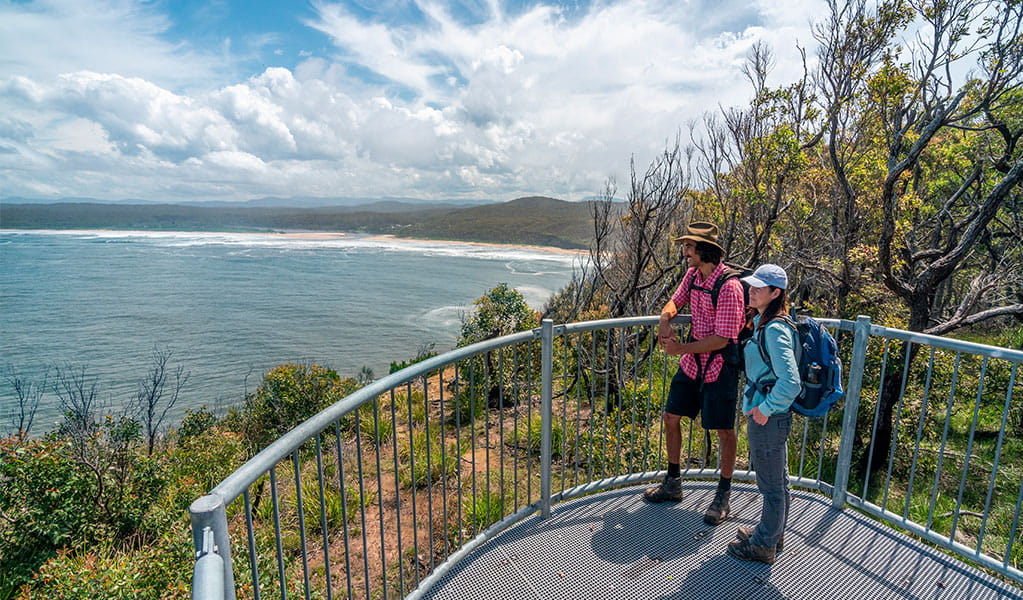 2 walkers admiring ocean views from Point Upright lookout. Credit: John Spencer &copy; DPE