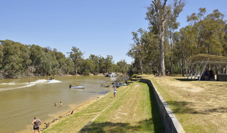 People fishing, paddling and swimming in the river at Five Mile picnic area in Murray Valley Regional Park. Photo: Gavin Hansford &copy; DPIE
