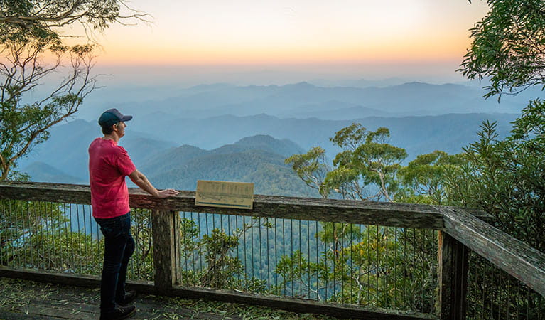 Visitor looking at views of New England National Park from Point Lookout. Photo: John Spencer/OEH