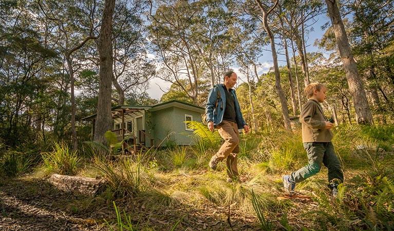 Father and son heading off for a walk from Toms Cabin in New England National Park. Photo: John Spencer &copy; DPIE