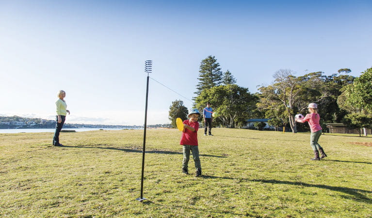 A family playing ball games on the grass at Bonnie Vale picnic area in Royal National Park. Photo: Simone Cottrell/OEH
