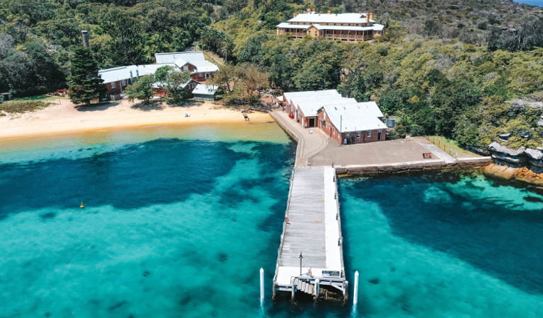 Aerial view of Q Station wharf and buildings in Sydney Harbour National Park. Photo: Q Station