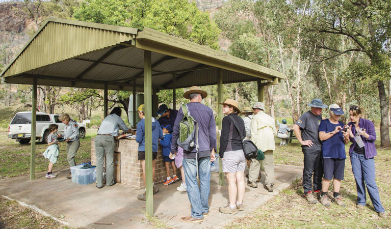 A group enjoying a barbecue at Canyon picnic area in Warrumbungle National Park. Photo: Simone Cottrell &copy; shared OEH and photographer