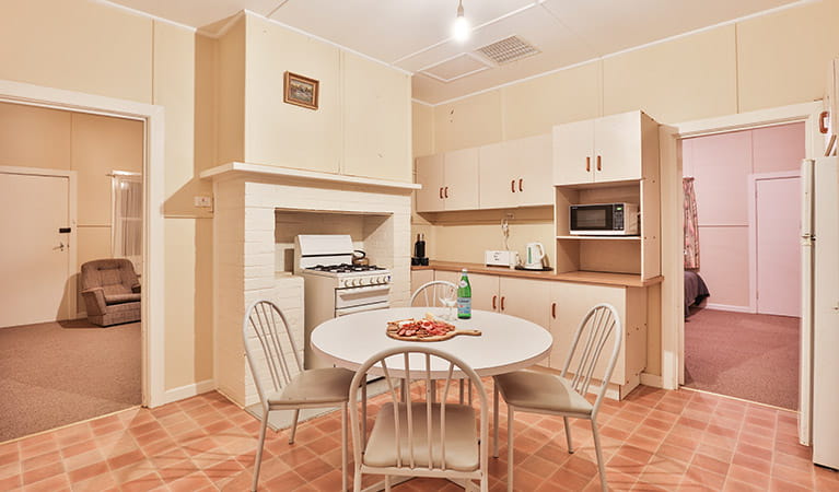 Kitchen and dining table at Willandra Cottage, Willandra National Park. Photo: Vision House Photography/DPIE