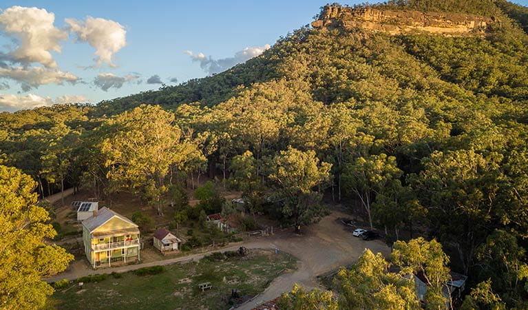 Arial view of Post Office Lodge in Yerranderie Private Town, surrounded by the rugged landscapes of Yerranderie Regional Park. Photo: John Spencer/OEH