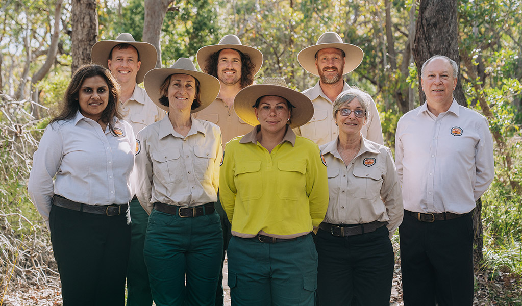 NPWS staff members in uniform with trees in the background. Credit: Remy Brand &copy; DPE