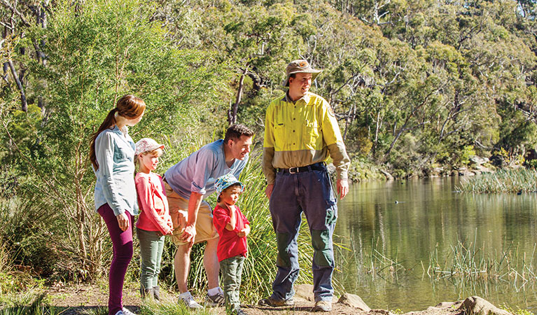 An NPWS ranger and family on a tour at Hacking River, Audley in Royal National Park. Photo: Simone Cottrell/DPIE