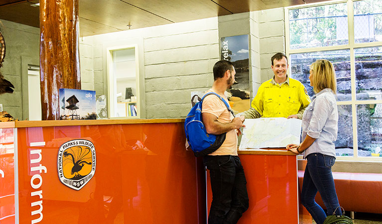 A ranger and park visitors at Royal National Park Visitor Centre, Royal National Park. Photo: Simone Cottrell/DPIE