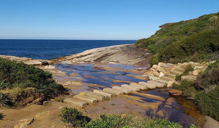 New stonework to help visitors cross a creek on the Royal Coast Track.  Credit: Lisa Sturis &copy; Lisa Sturis/DPIE