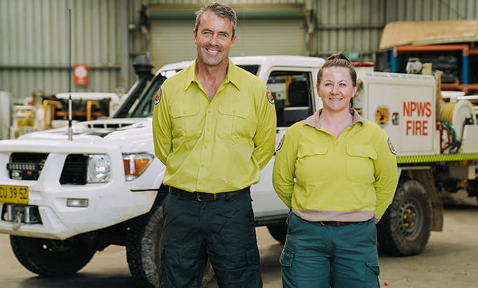 NPWS staff in front of a NPWS fire vehicle in a depot. Credit: Remy Brand &copy; DPE