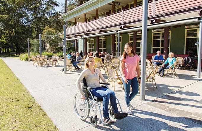 Person using a wheelchair at Audley Dance Hall Cafe. Photo: Simone Cottrell/DPIE