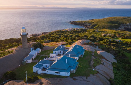 Aerial view of Montague Island lighthouse and cottages at sunset, Montague Island Nature Reserve. Photo: Daniel Tran/DPIE