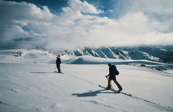 Two skiers in Kosciuszko National Park. Credit: Tyson Millar/DPE &copy; Tyson Millar