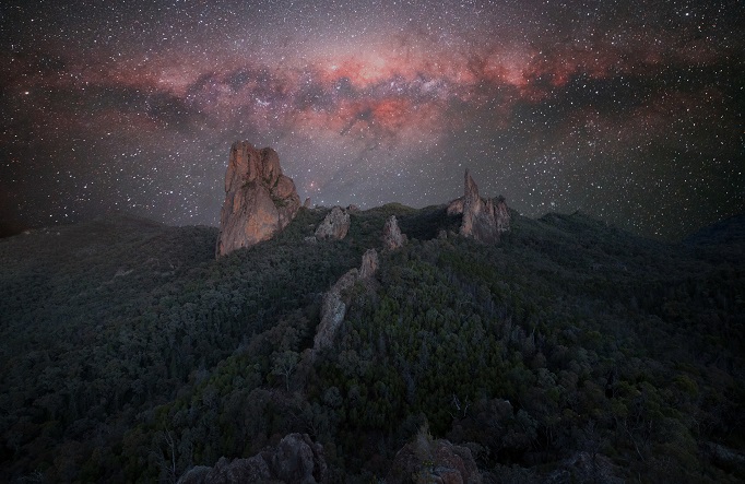 The massive Breadknife and Grand High Tops mountains at night with the Milky Way shining above, Warrumbungle National Park. Credit: Ben Heaton/DCCEEW © the photographer