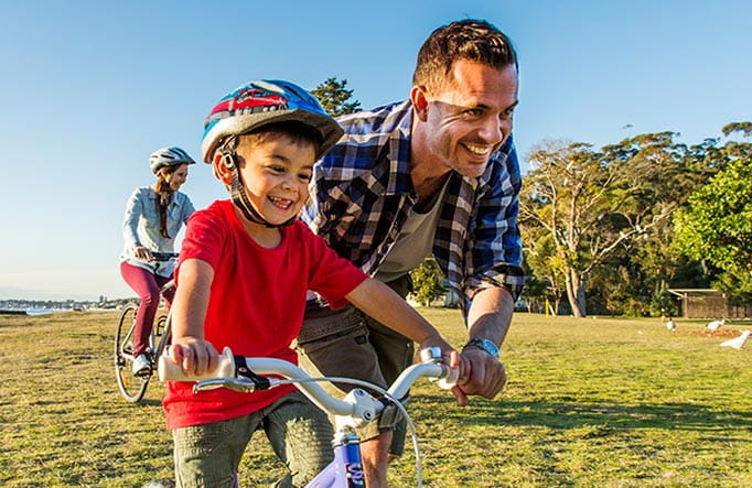 Young kids bike riding at Bonnie Vale picnic area in Royal National Park. Photo: Simone Cottrell/DPIE