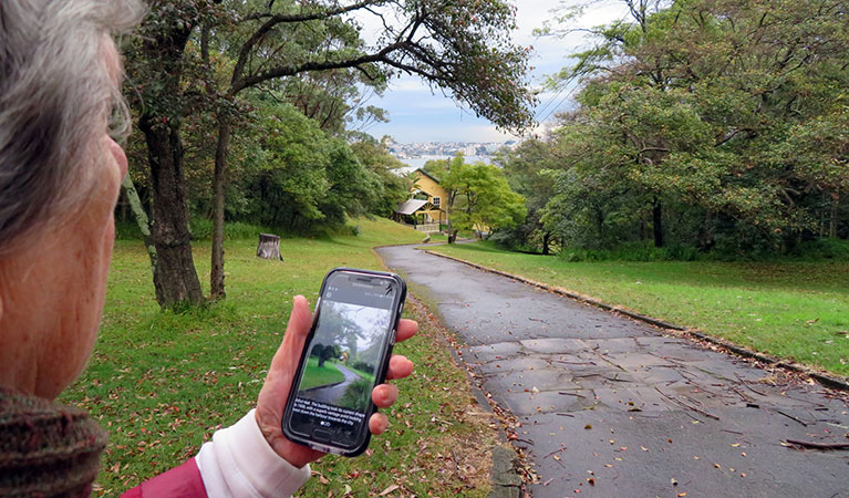 Walker using the self-guided tour app. Photo: K Cooper/OEH