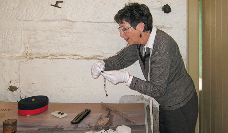 A volunteer working on the Fort Denison heritage project. Photo: OEH