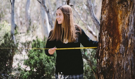 Secondary school student measuring a transect, Kosciuszko National Park. Credit: Remy Brand &copy; Remy Brand/DCCEEW