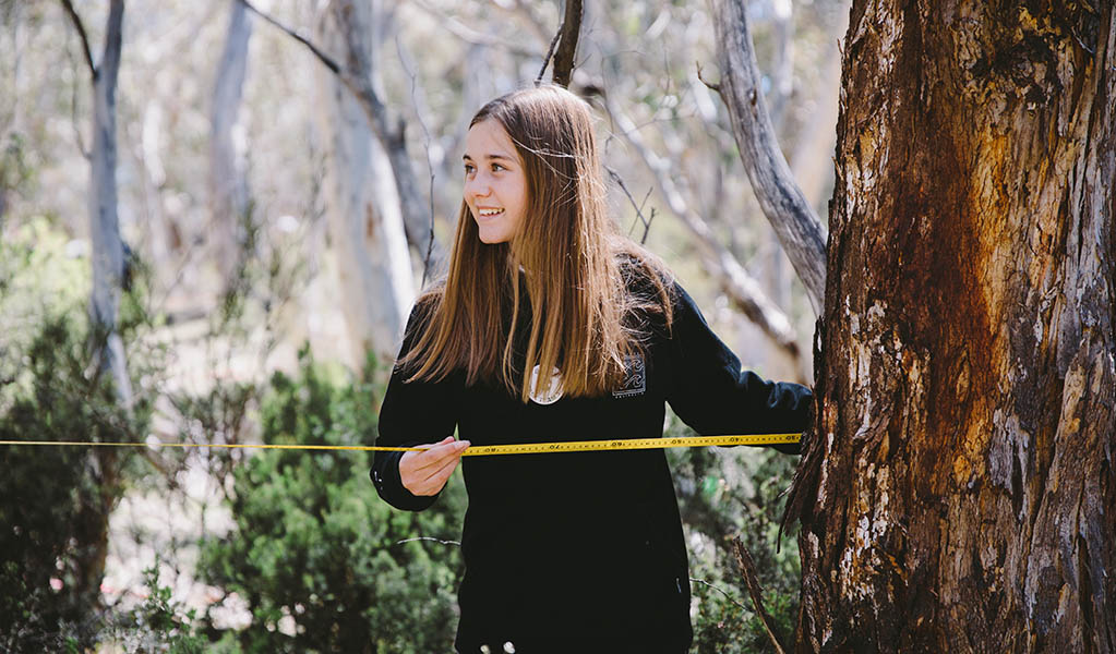 Student measuring a sample quadrant during an excursion activity in Kosciuszko National Park. Photo: Remy Brand &copy; DPE