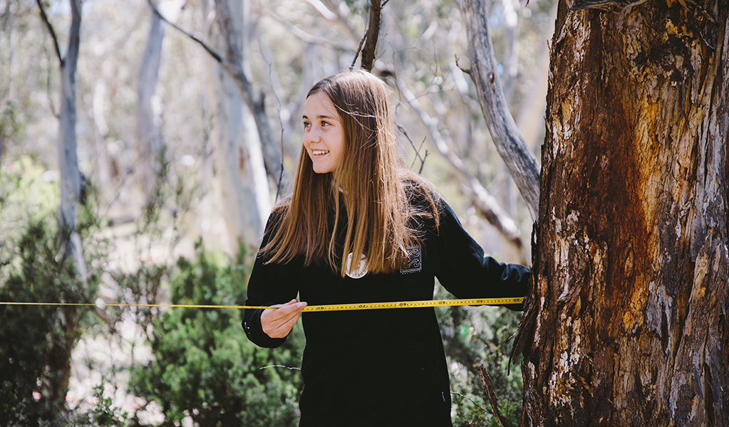 Student measuring a sample quadrant during an excursion activity in Kosciuszko National Park. Photo: Remy Brand &copy; DPE