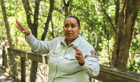 An Aboriginal guide sharing stories of the Birpai People on a bush tucker school excursion in Sea Acres National Park. Photo: Karina Otoya Davilla &copy; DPIE