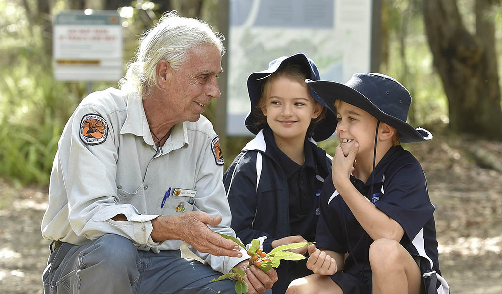 A NSW National Parks guide with a pair of students on a school excursion. Photo: Adam Hollingworth &copy; DPE