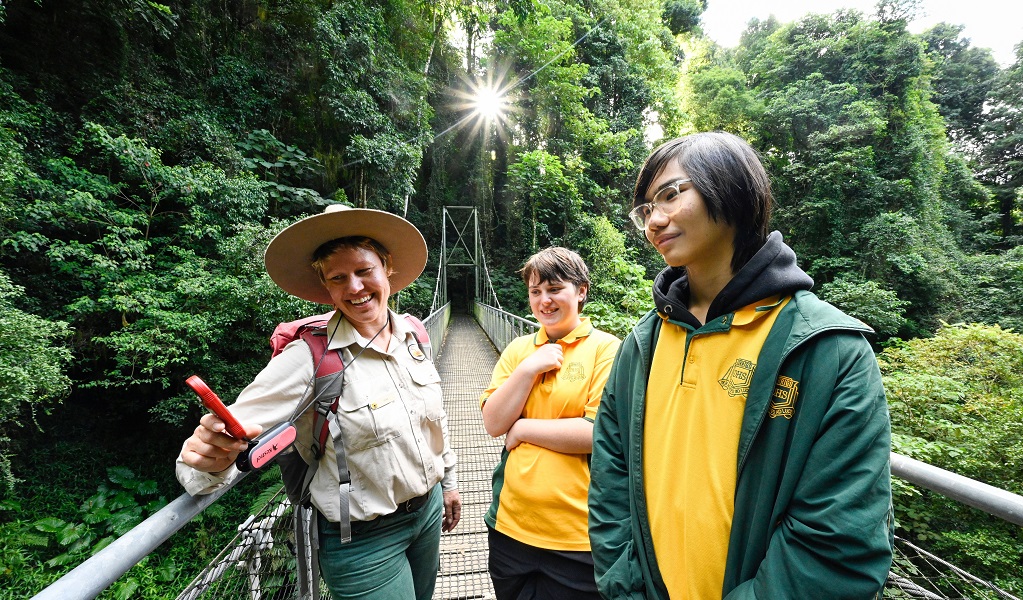 An NPWS ranger shows Year 12 students a Kestrel Weather meter, Dorrigo National Park. Photo: Adam Hollingworth/DCCEEW &copy; DCCEEW