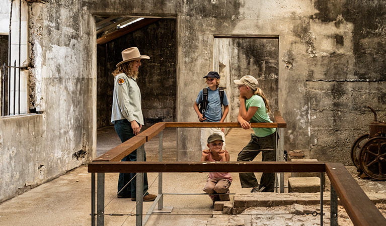 Image of kids talking to a ranger while exploring Trial Bay Gaol.