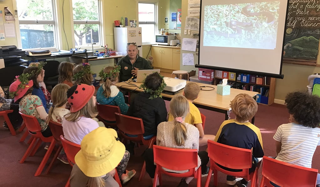 NPWS Aboriginal guide speaks to a primary class. Photo: Mumbulla PS. &copy; OEH
