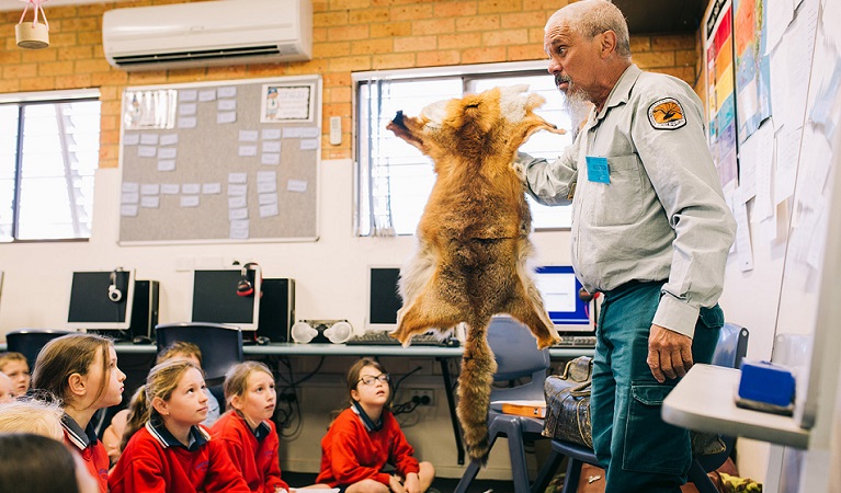 An Aboriginal NPWS educator leading an incursion at Coffs Harbour Christian Community School, 2019. Photo: Jay Black &copy; NPWS