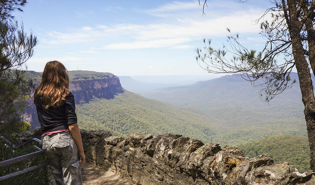 Bushwalker enjoying the view on the Overcliff-Undercliff Walking Track in Blue Mountains National Park. Photo: Steve Alton &copy; OEH