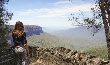 Bushwalker enjoying the view on the Overcliff-Undercliff Walking Track in Blue Mountains National Park. Photo: Steve Alton &copy; OEH