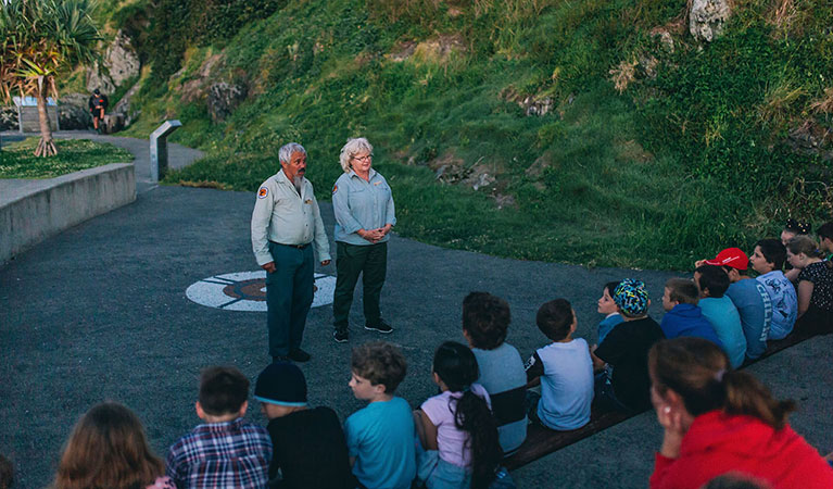 A group of students listening to their guides on a Muttonbirds by moonlight school excursion. Photo: And the Trees Photography &copy; DPIE